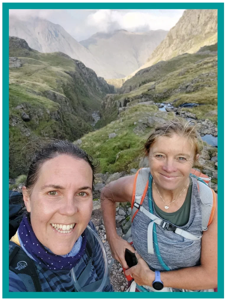 Ros and a walker smiling during a bespoke walk in a Lake District mountain valley