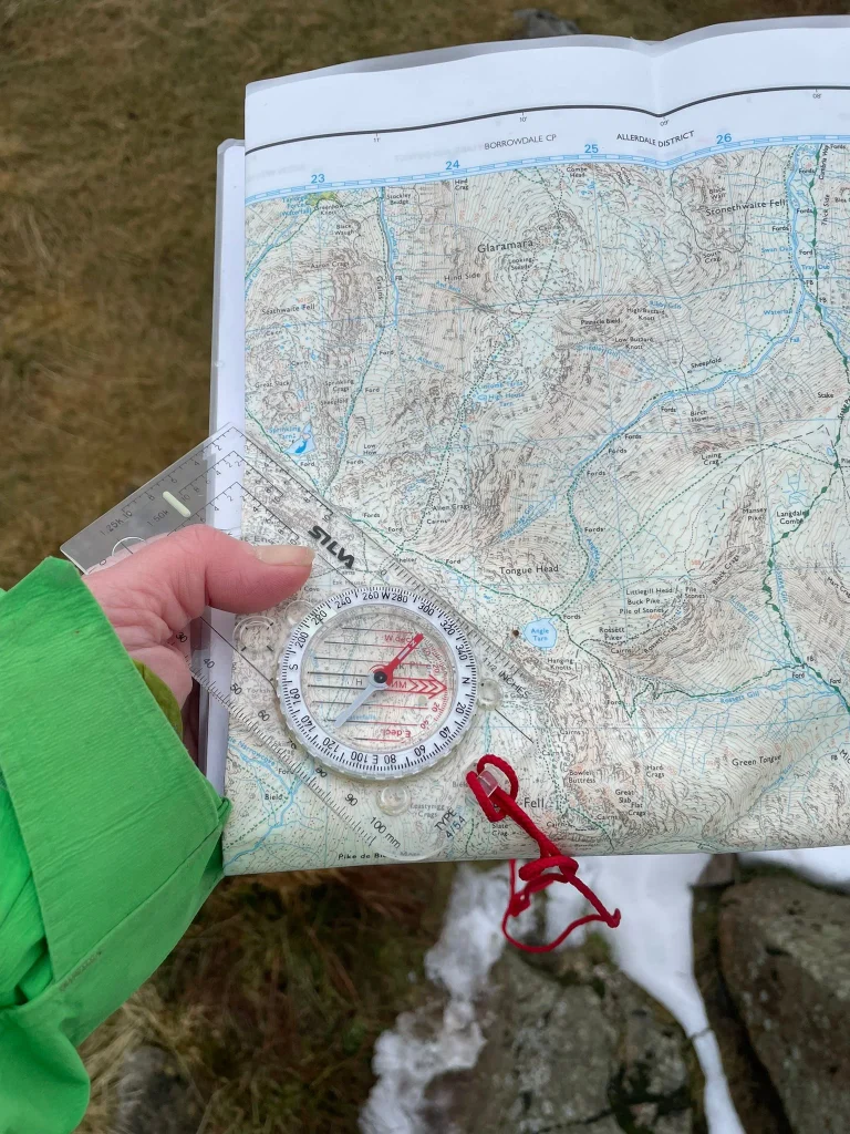 Compass and map used for hill navigation training