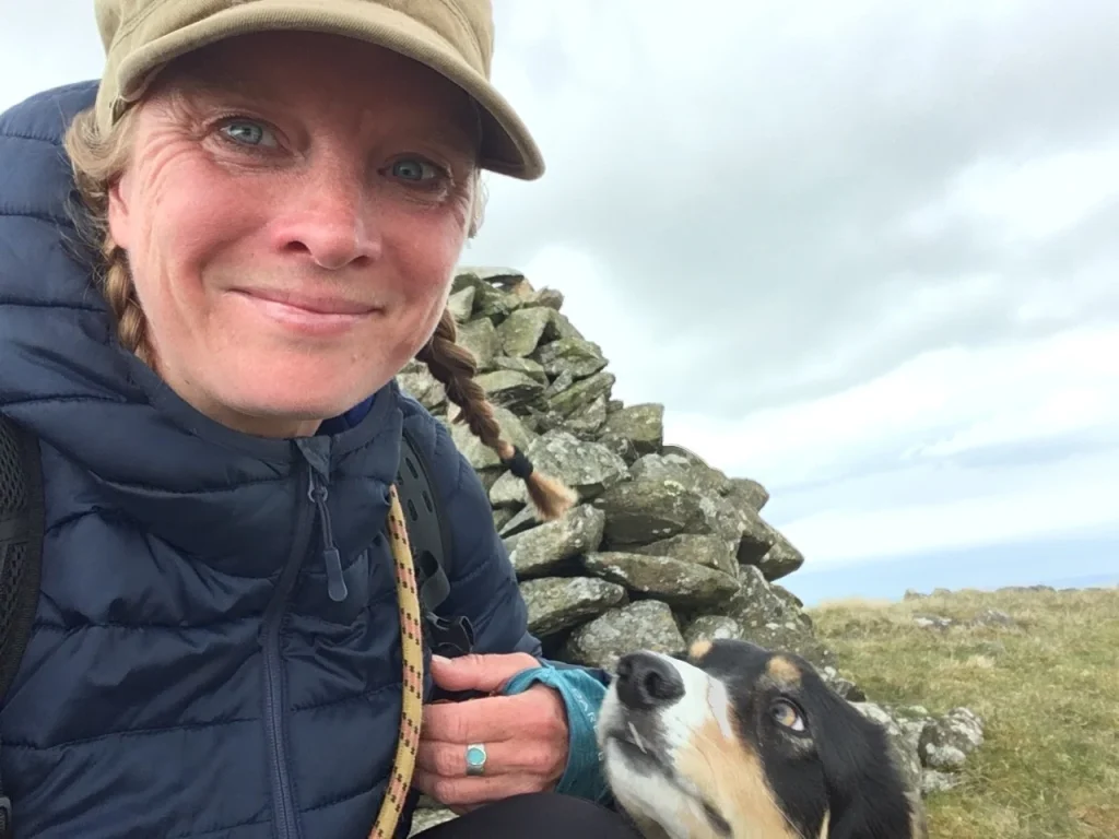Ros with Blea during a walk beside a stone wall in the Lake District