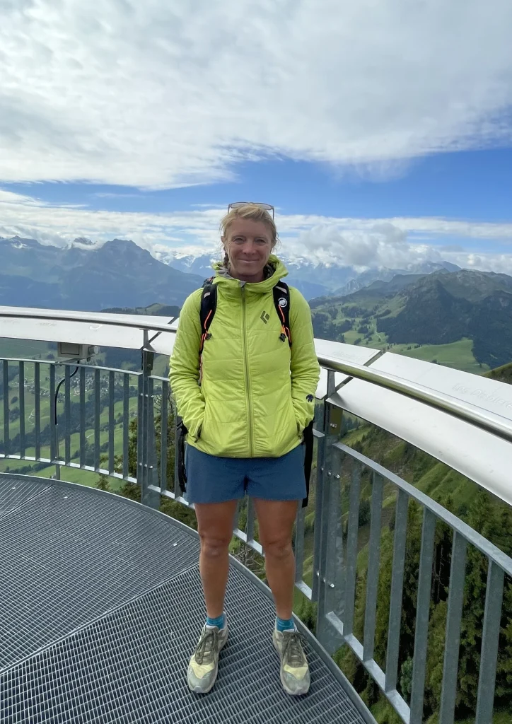 Ros enjoying views from a mountain lookout platform