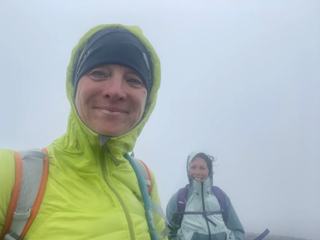 Ros and a walker on a misty guided walk in the Lake District