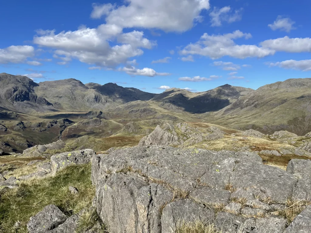 Rocky fell top view near Green Crag looking towards Harter Fell