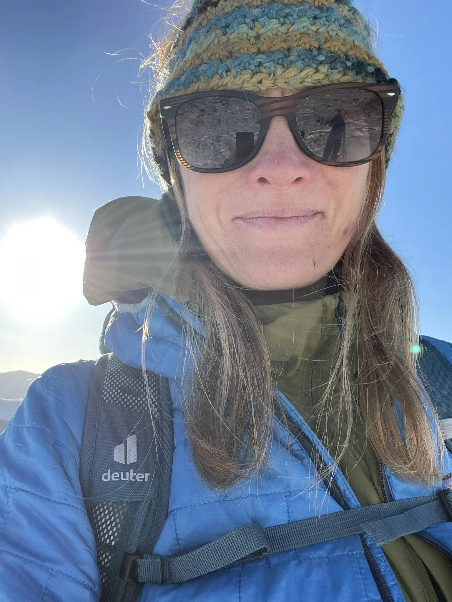 Close-up selfie of Ros during a sunny walk in the Lake District mountains