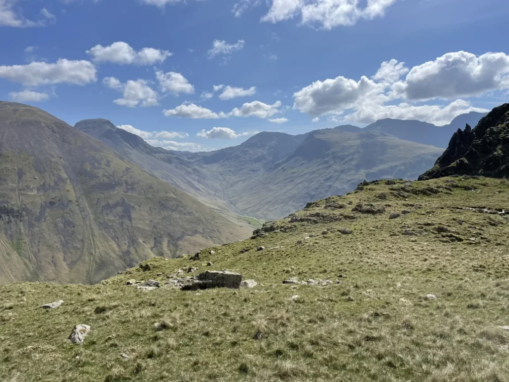 Grassy fell ridge with views towards Red Pike, Scoat Fell, Steeple and Haycock