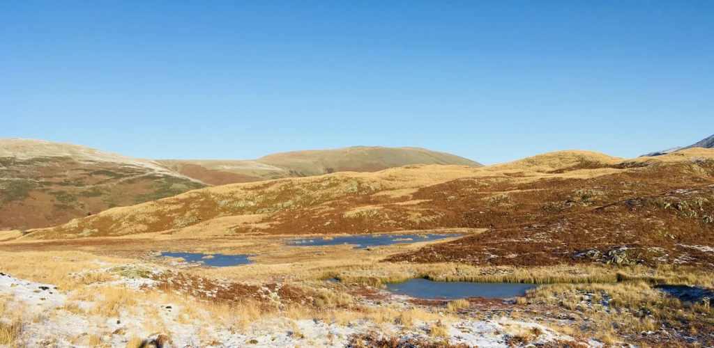Small tarns across the Six Tarns above Eskdale in the Lake District