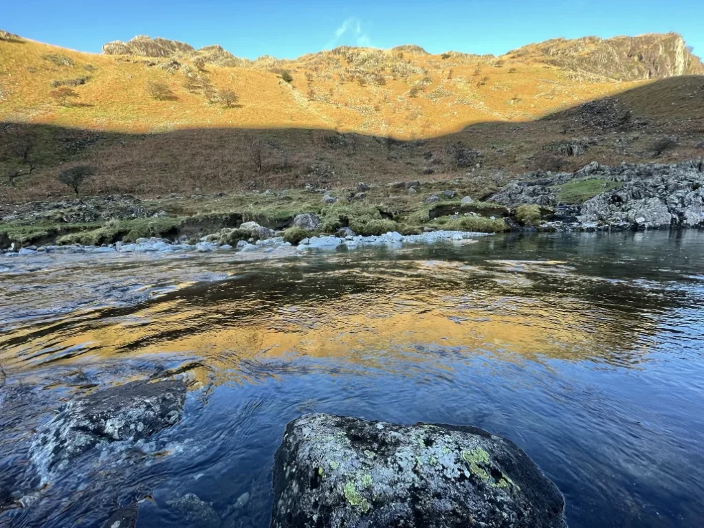 Clear river and rocky valley landscape in Upper Eskdale in the Lake District
