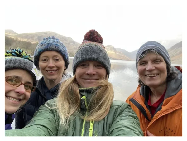 Women hikers taking a selfie during a guided walk in the Lake District