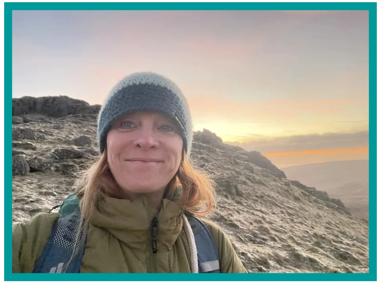 Mountain guide on a Lake District fell during sunrise