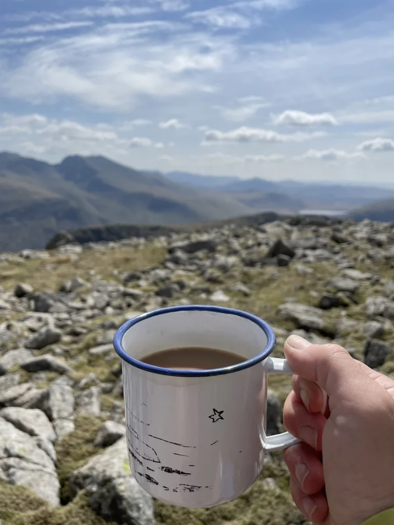 Cup of coffee with sweeping Lake District mountain views